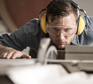 Man Sawing Wood